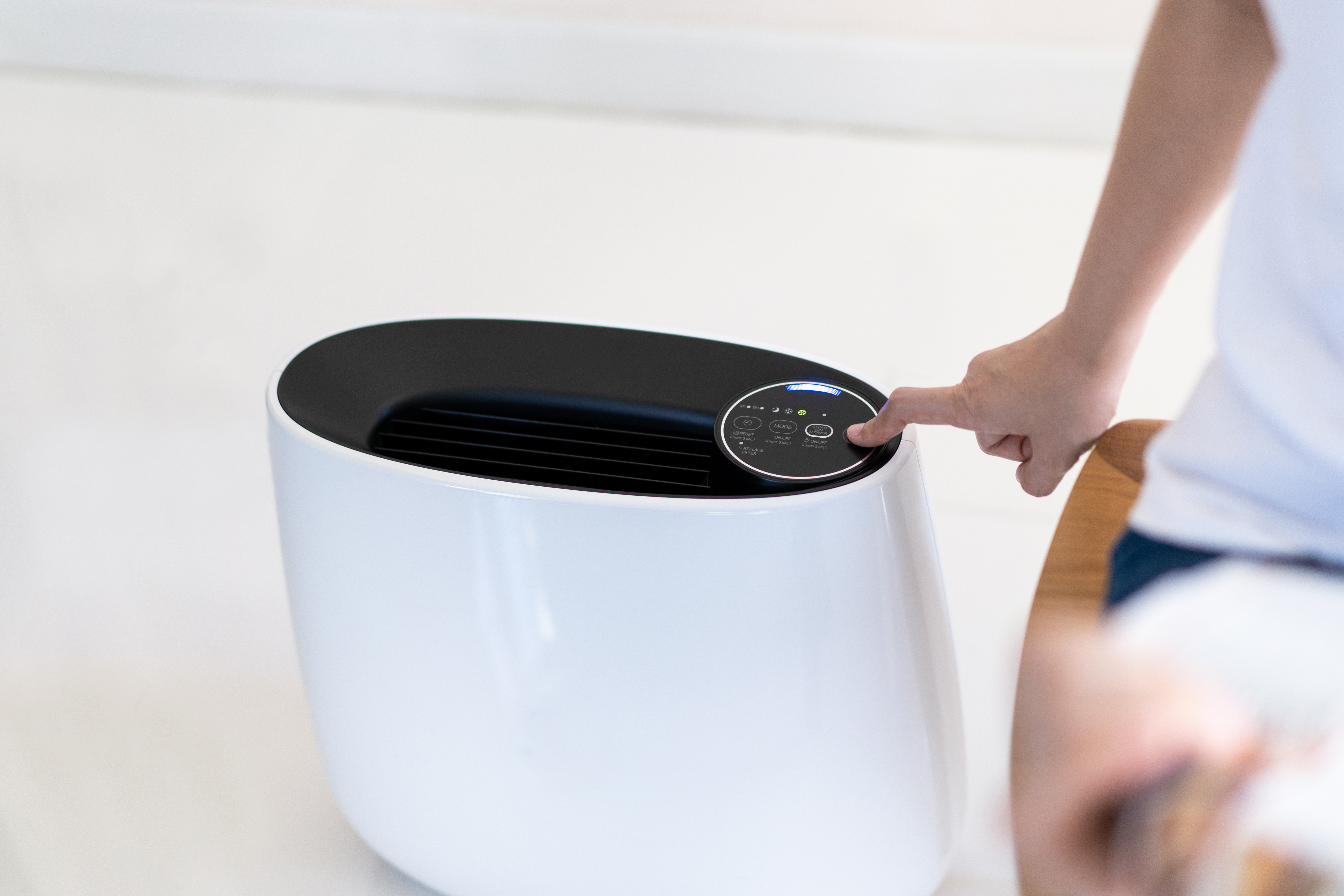 A sleek portable air conditioner with digital controls.