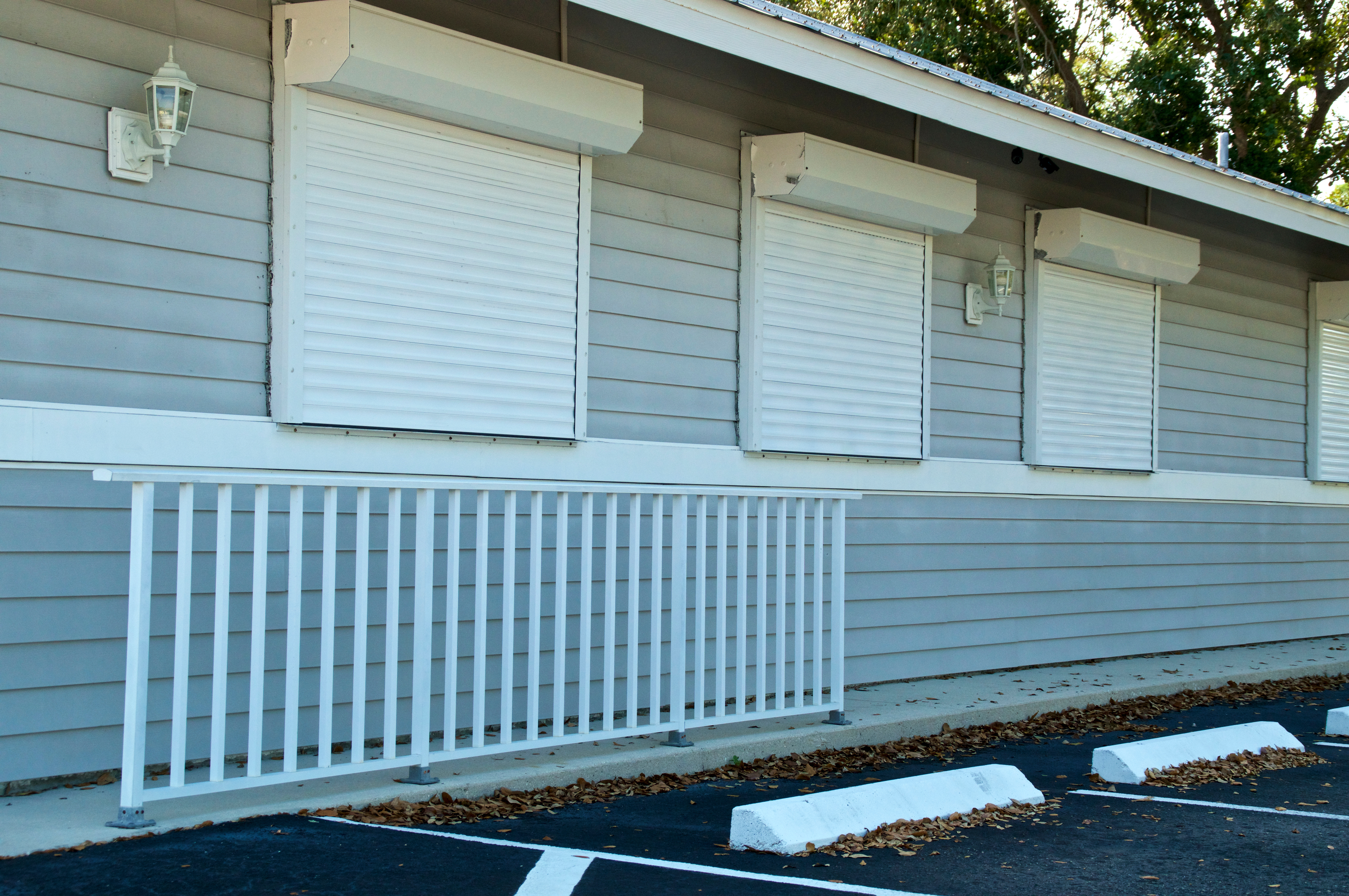 Strong, reliable hurricane shutters protecting windows - essential storm protection.