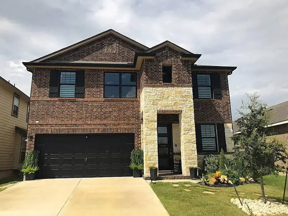 Stunning two-story brick home with new window installations in Corpus Christi.