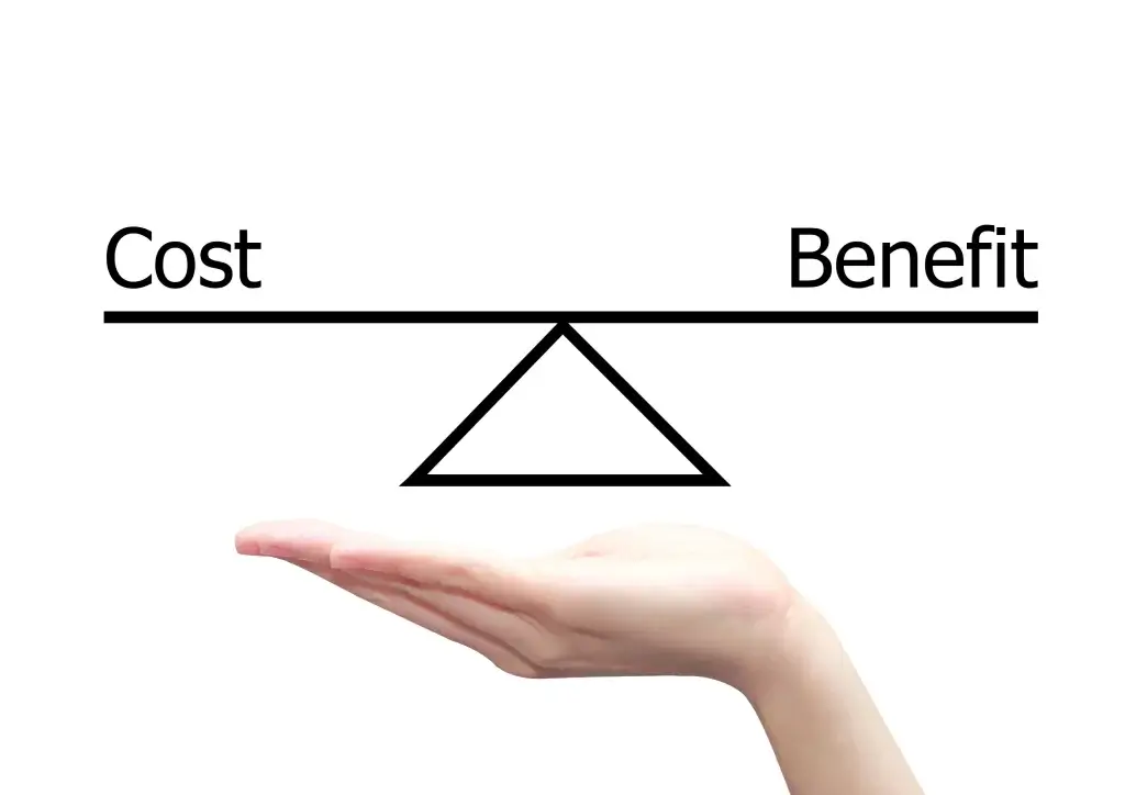 Balanced scale representing cost and benefit in window replacement.